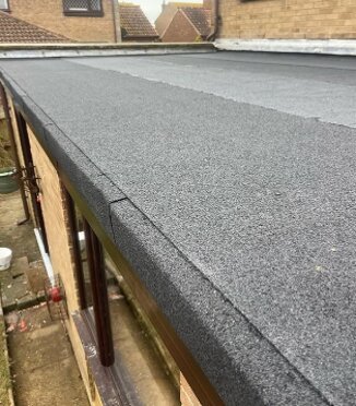 Completed grey GRP flat roof with upstands