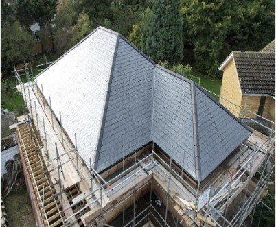 Slate repairs blended into the existing roof